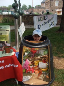 Boy in a cut-away compost bin